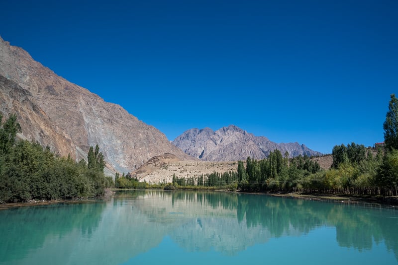 blue hues of phander lake while backpacking pakistan