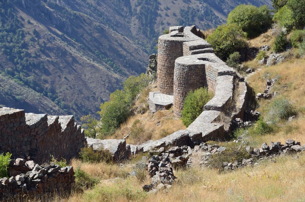 ruins of an old fort on a mountain in Armenia