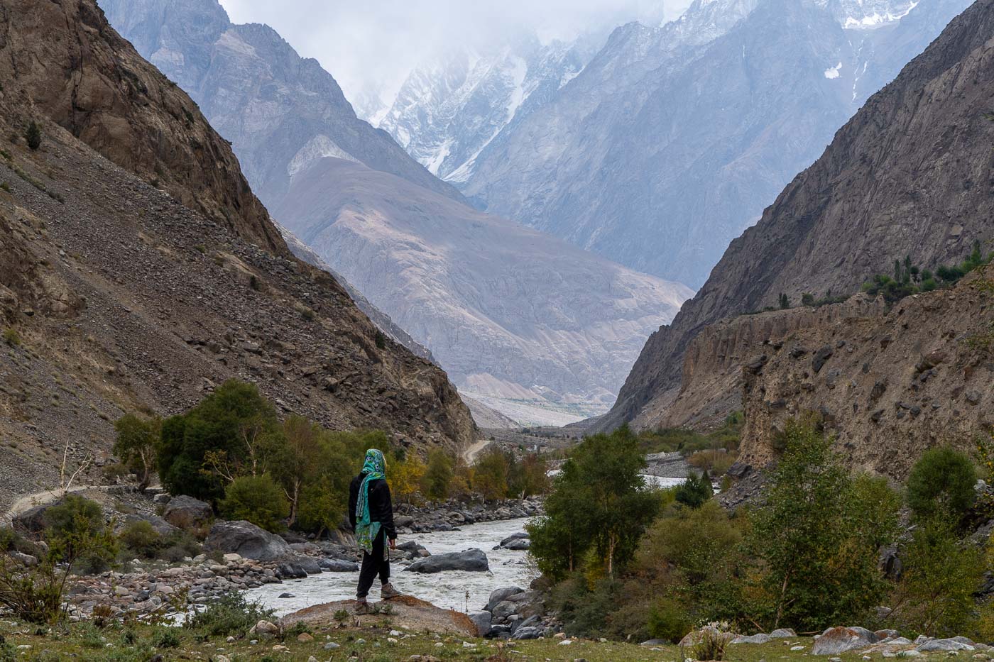 girl looking out at mountains in pakistan