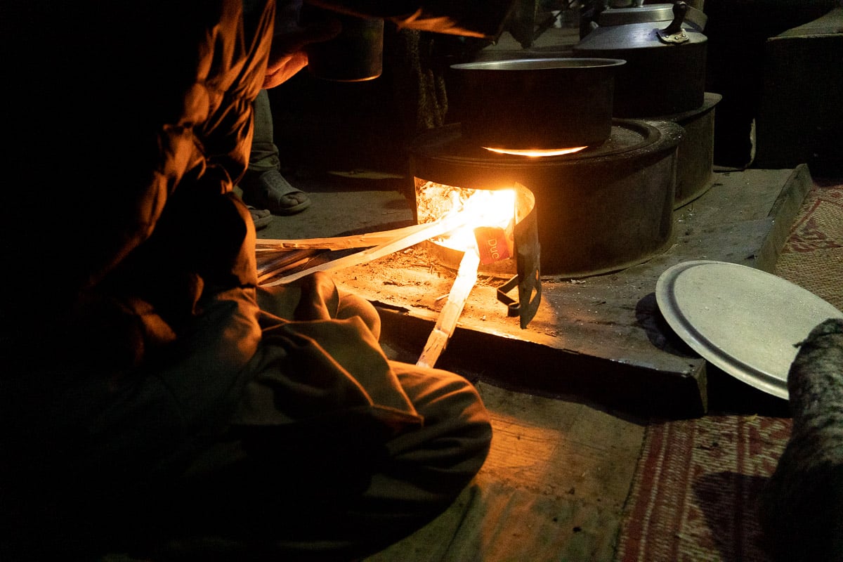 bright orange fire burning on wood in a stove in a host family's home