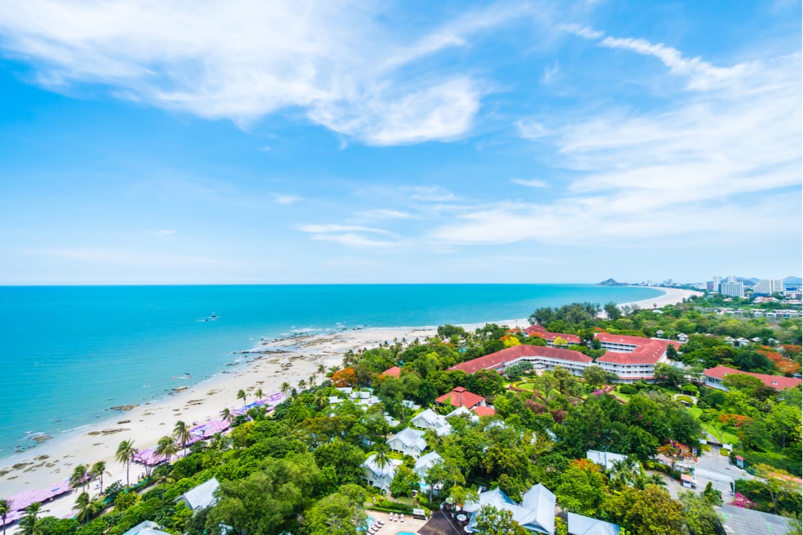 A landscape views of hua hin city coastline with lush greenery and buildings in Thailand