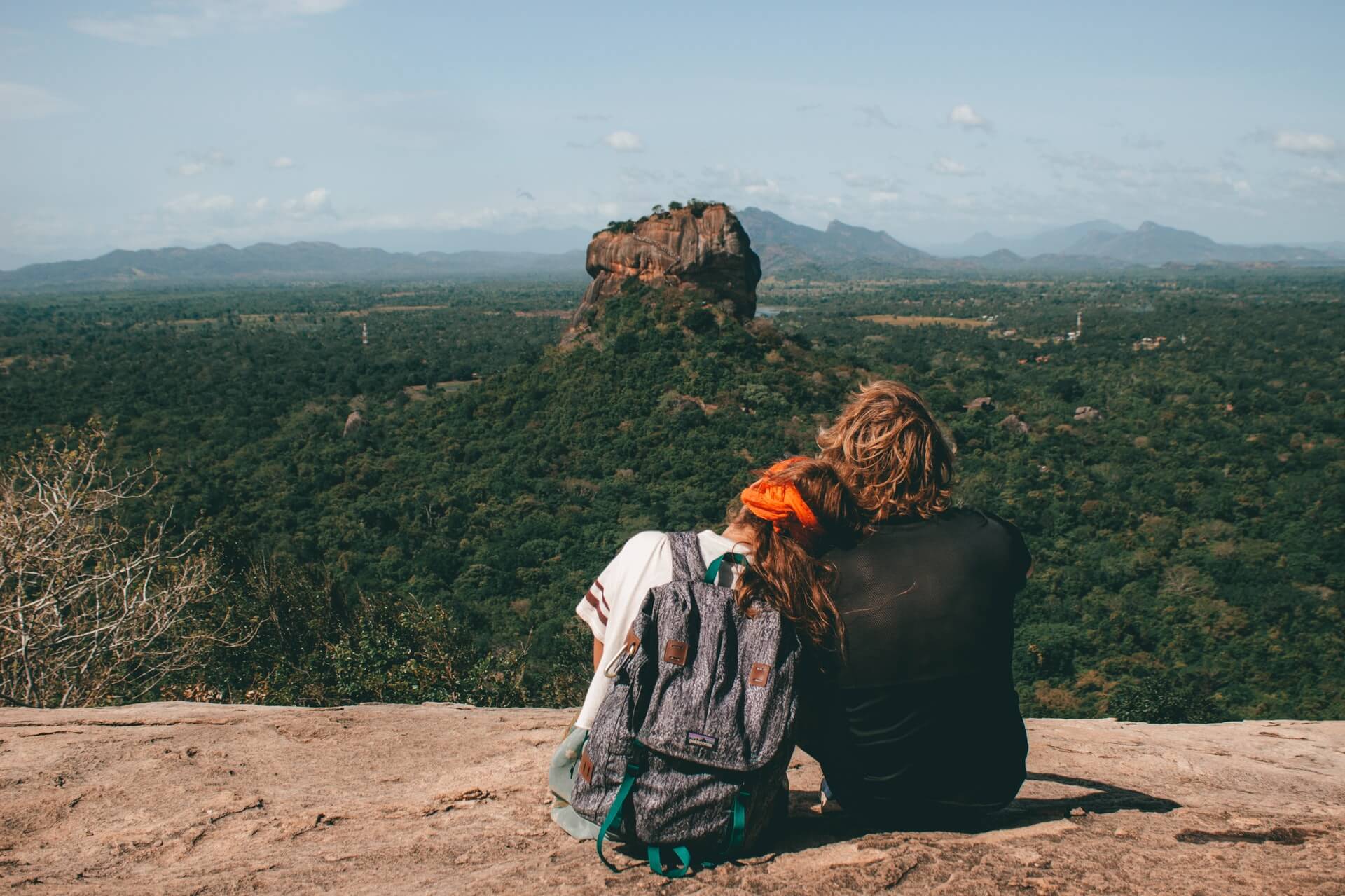 couple sitting together in sri lanka while traveling as a couple
