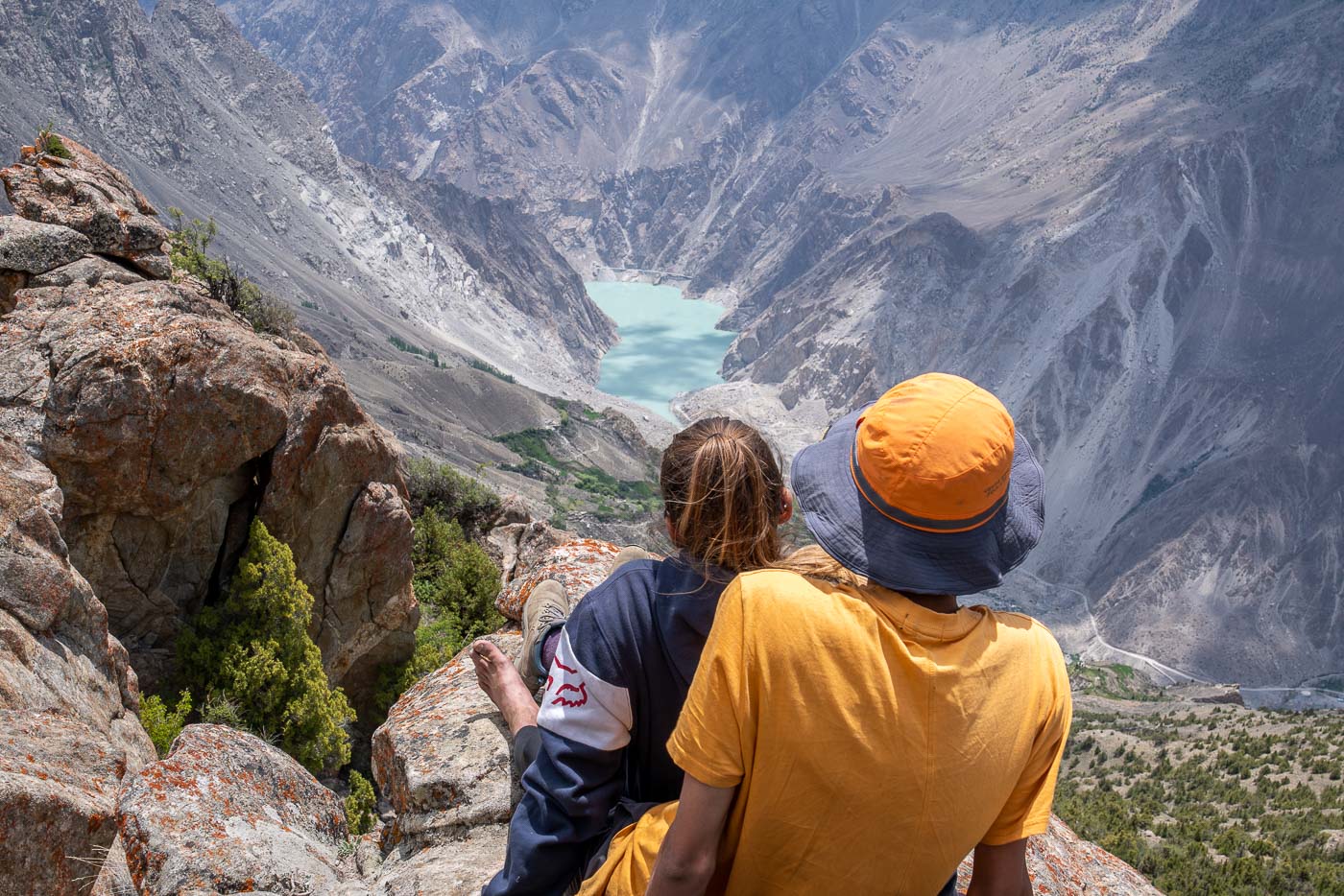 man and a woman overlook a scenic view in pakistan