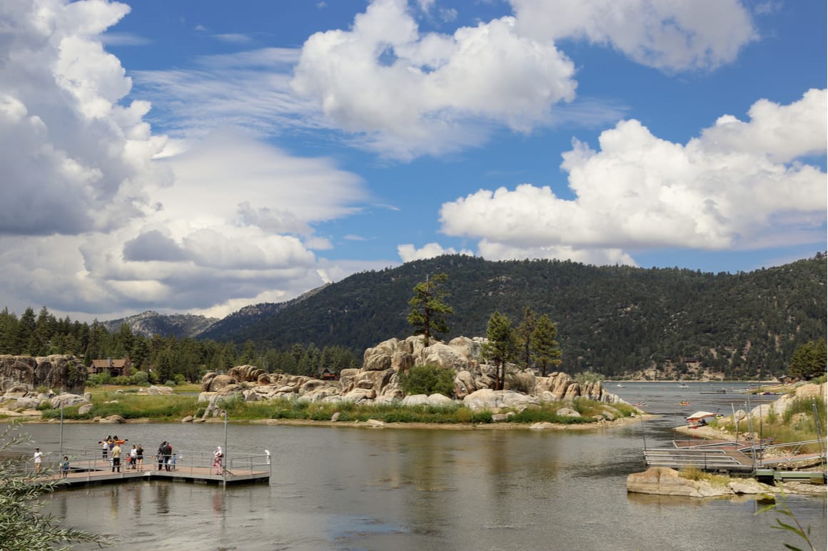 Boulder Bay park Big Bear Lake California, people sightseeing on the dock looking out at the forest