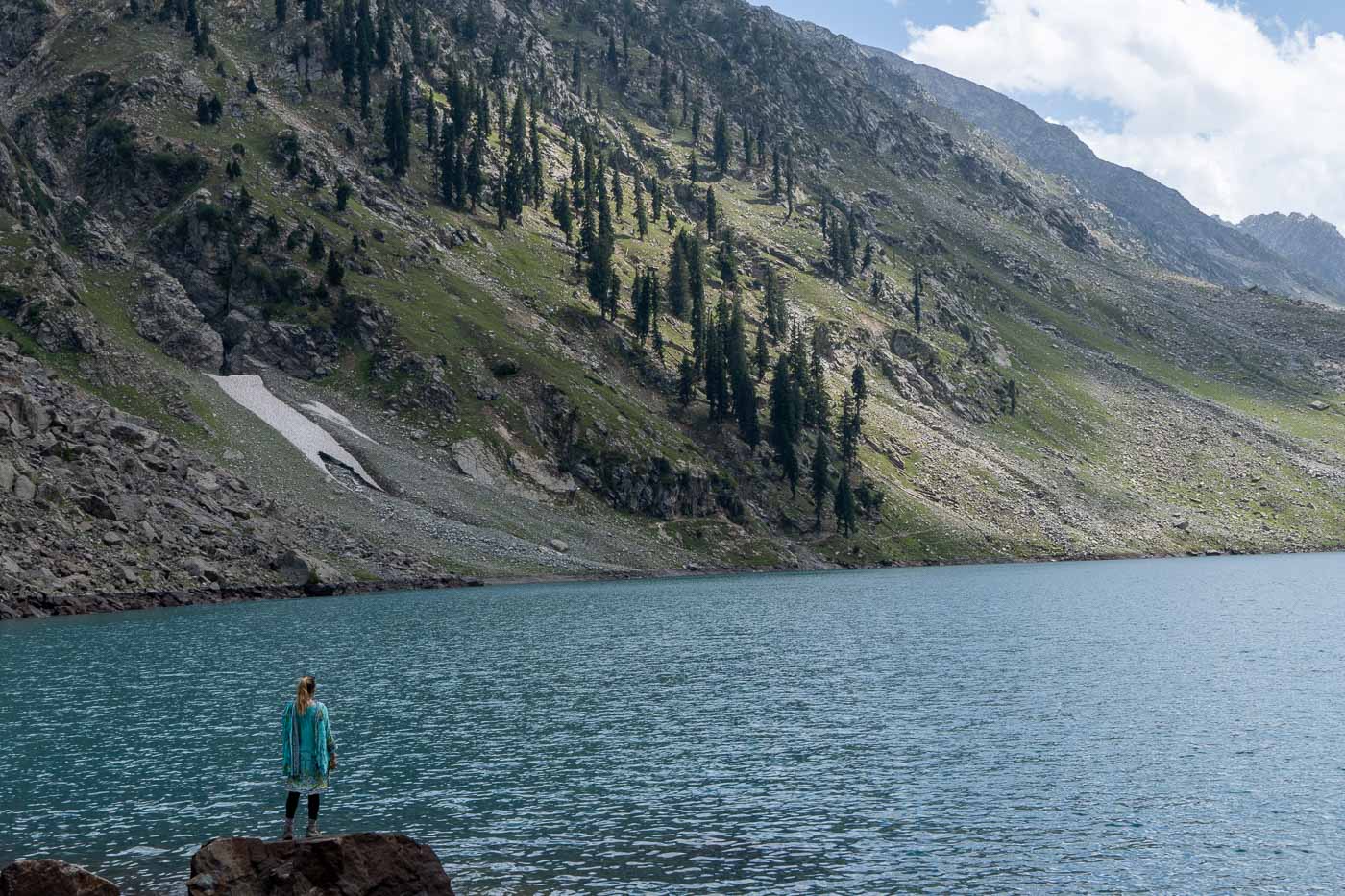girl standing at blue lake in swat valley pakistan