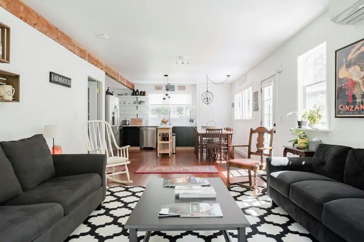 Living room and kitchen area in this Contemporary B&B