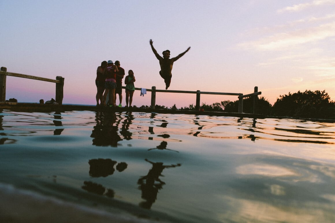 people diving into water