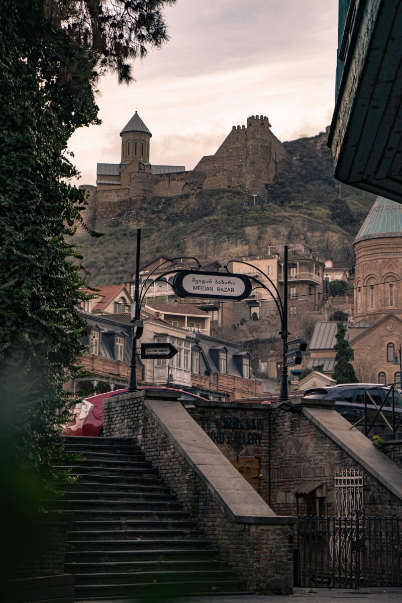 View of an old Tbilisi market and Narikala fortress in the background.