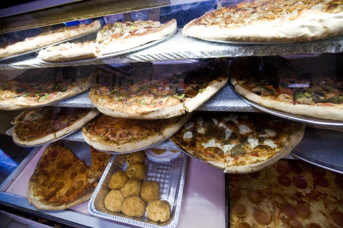pizzas sitting on display in boston's italian north end