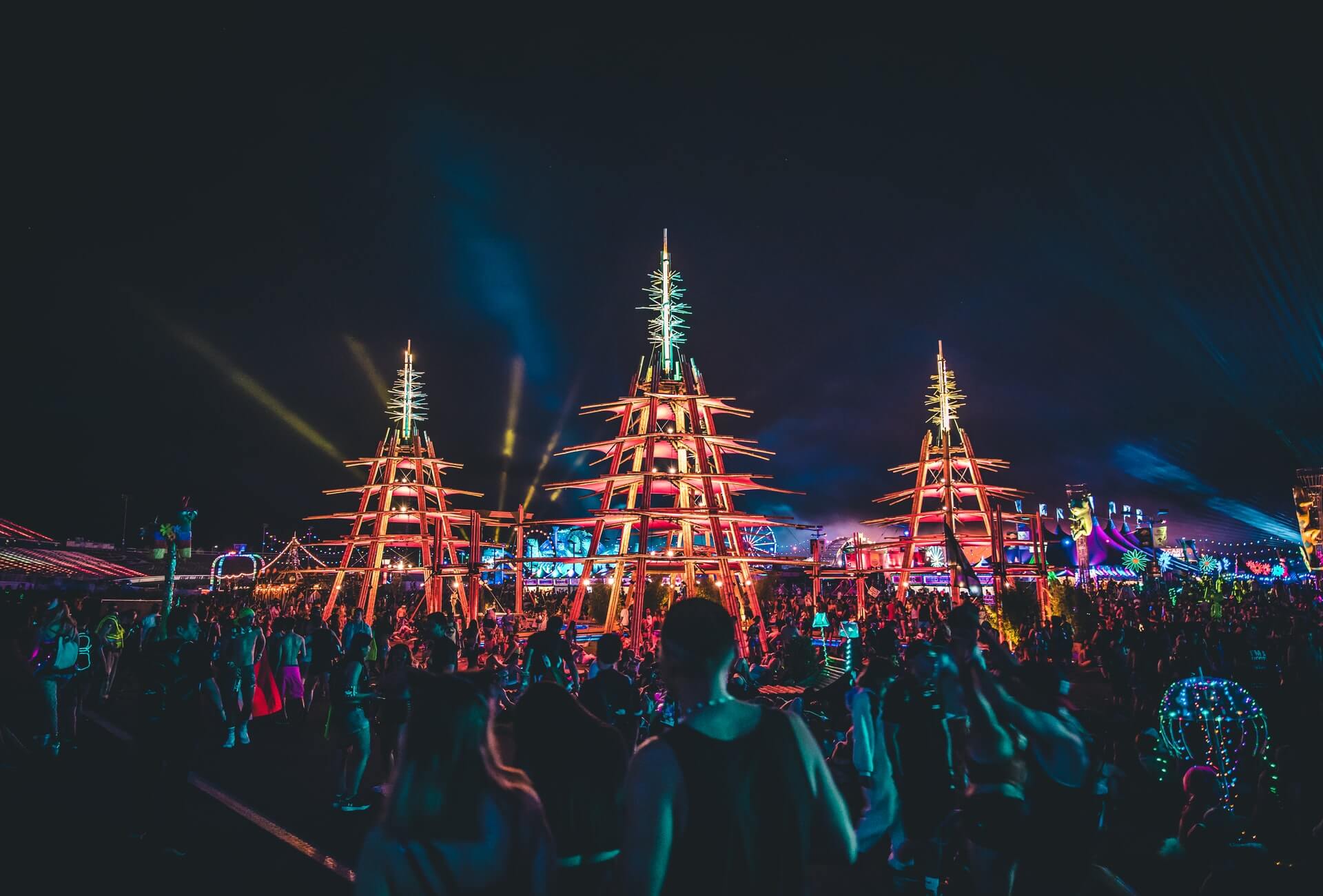 colorful lights and stages at a music festival in las vegas