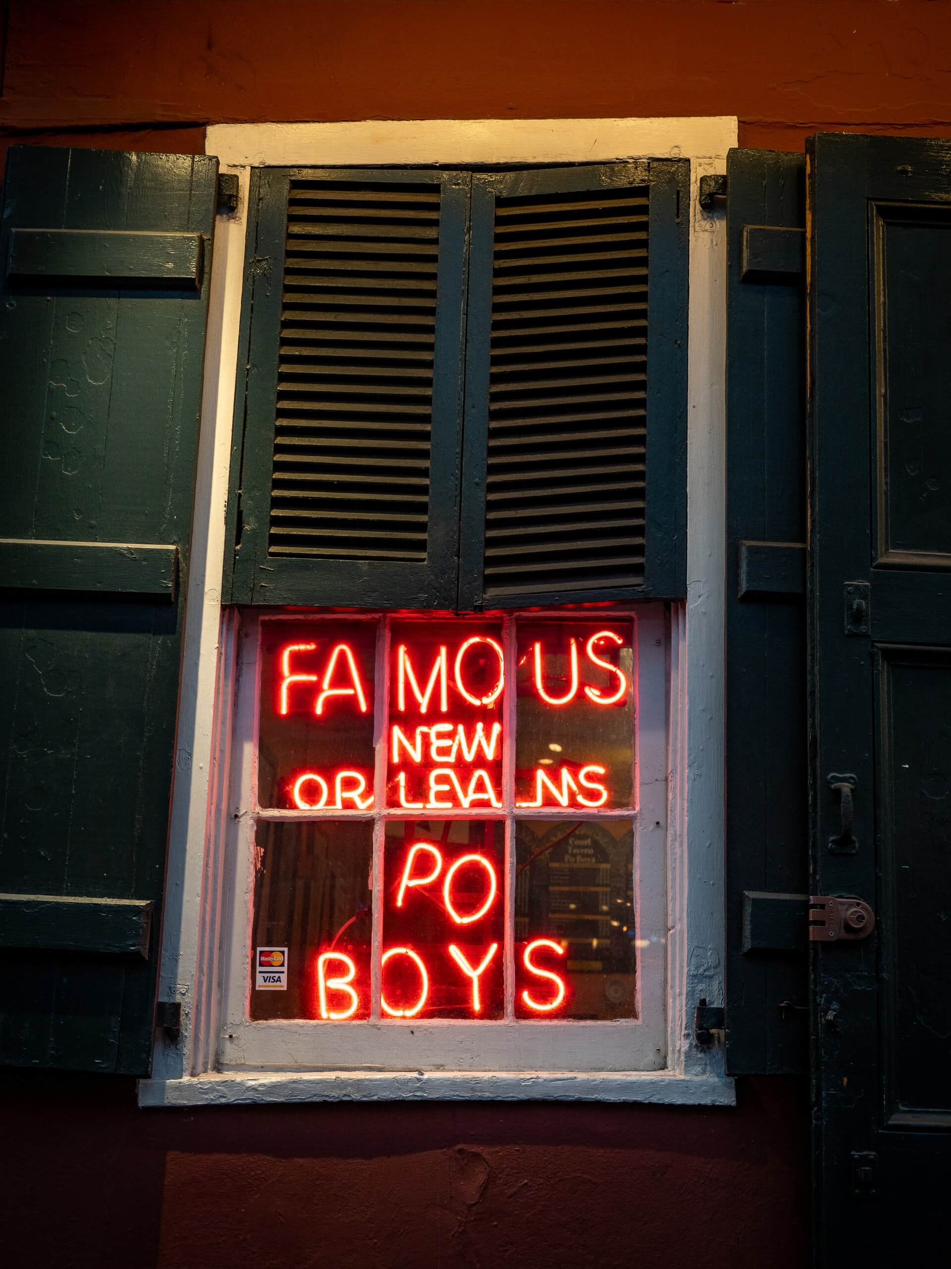 lit up new orleans po boys food shop sign