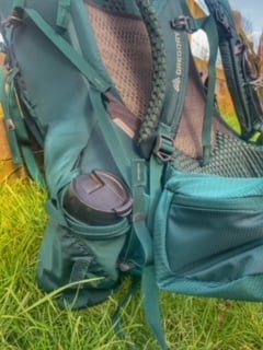 Side view of Gregory Deva 60 with water-bottle in side holder.