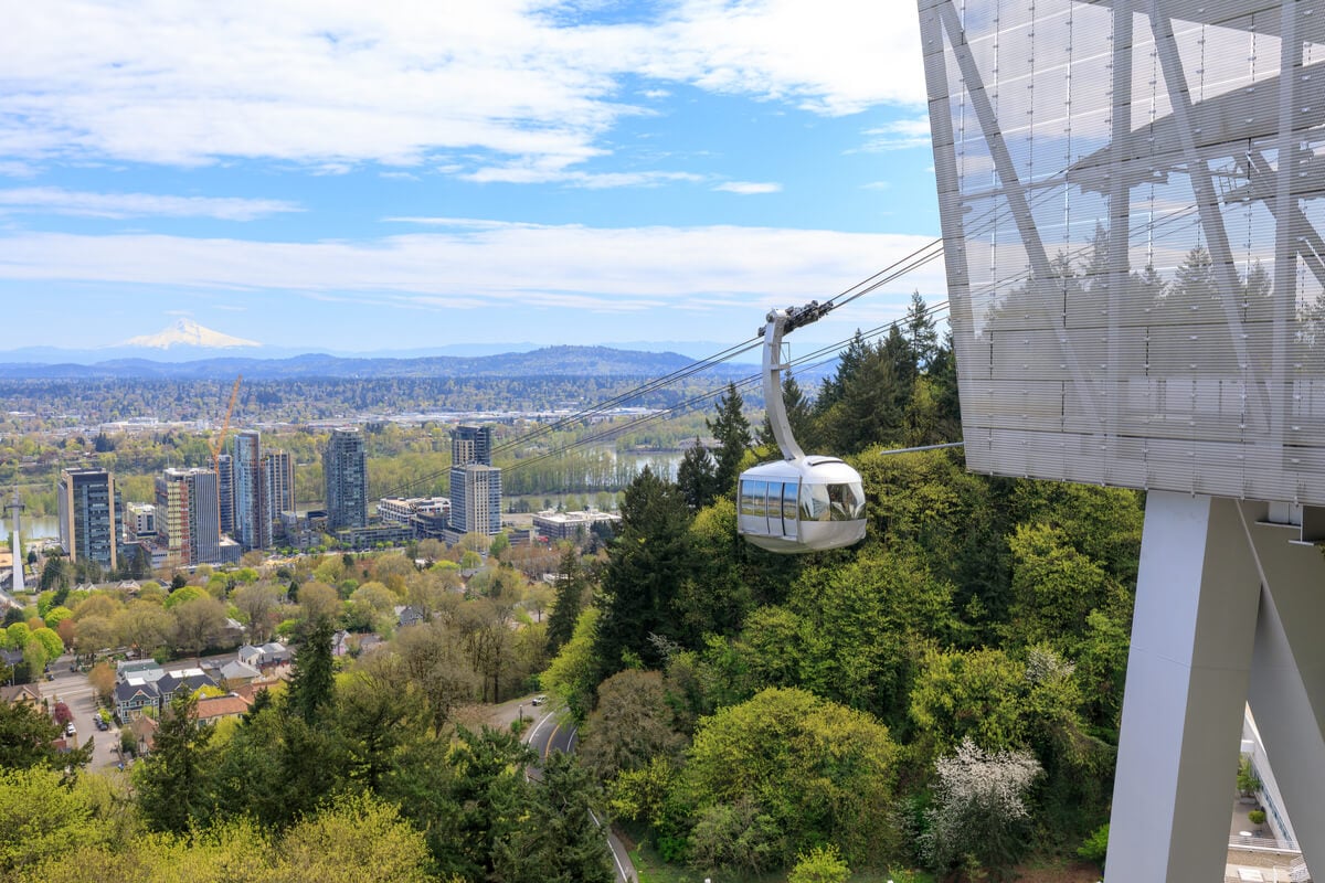 aerial tram with mt hood and greenery in the background backpacking portland