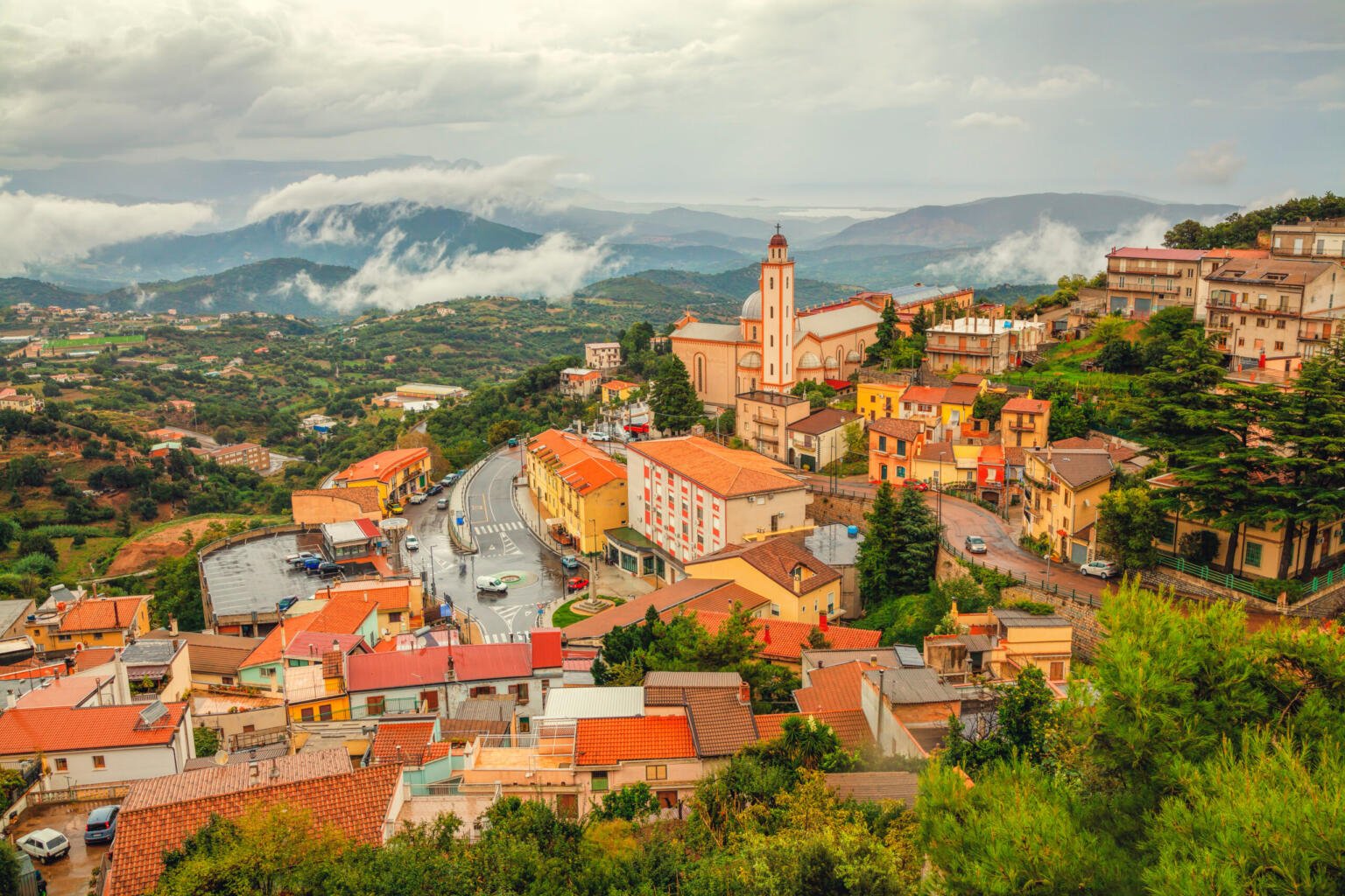 View over Nuoro town surrounded by mountains and clouds in Sardinia, italy