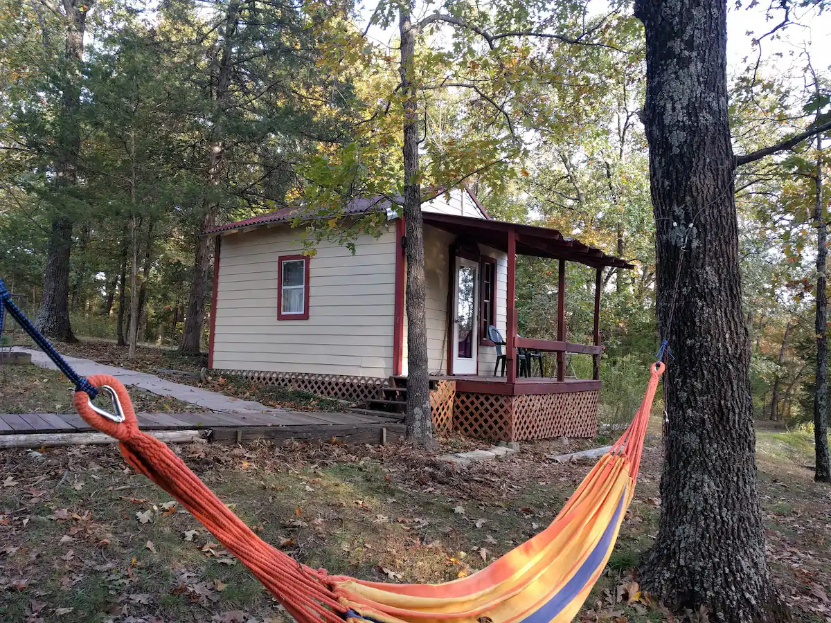 colorful hammock with small cabin in missouri in the background