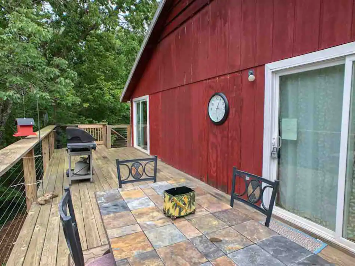 red cabin with outdoor deck in missouri