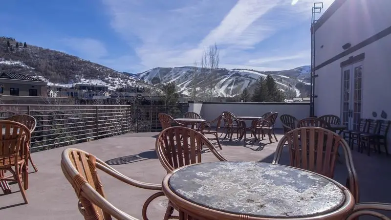 chairs with snow covered hills in packground best hostel in salt lake city