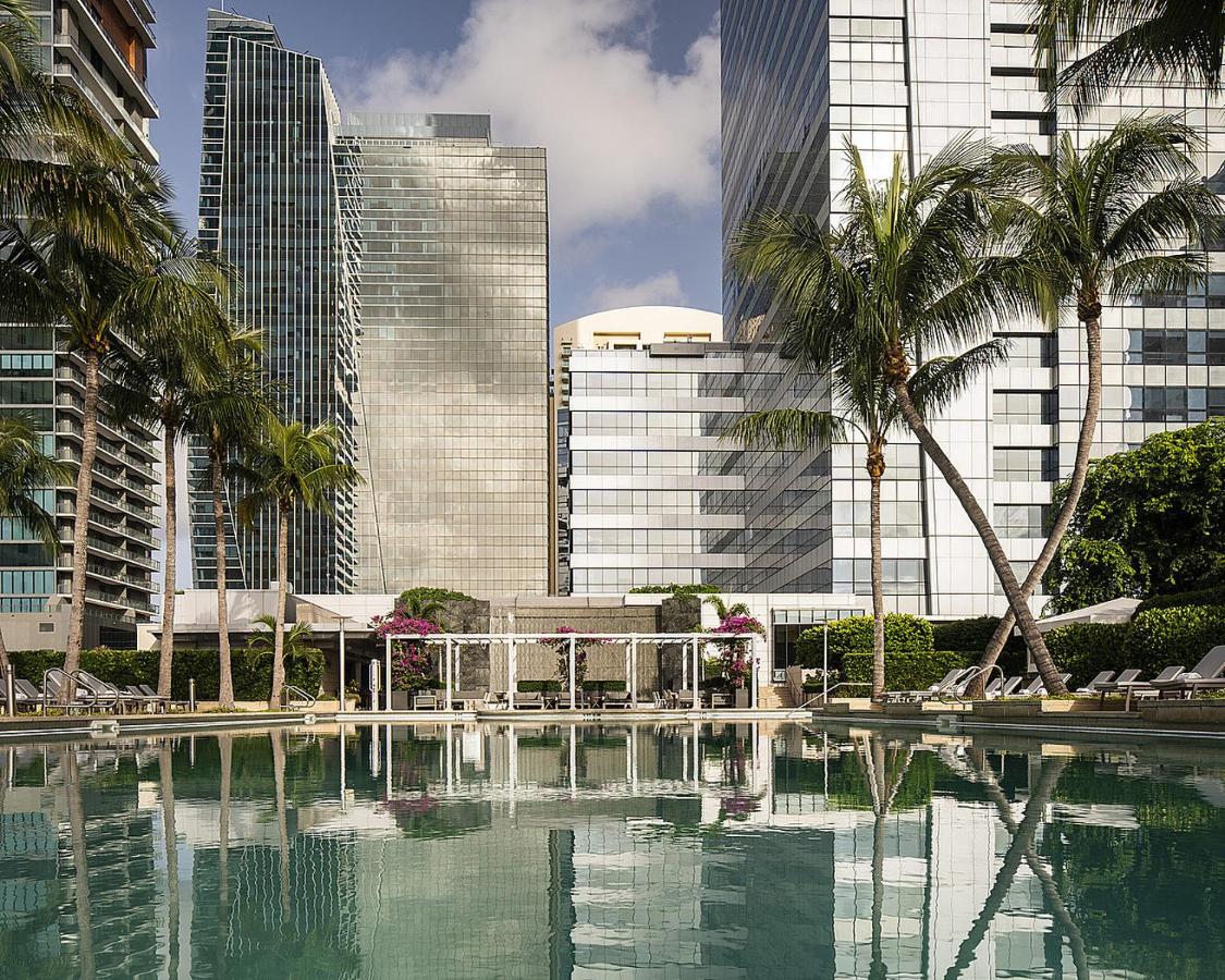 reflective pool at the best hotel in miami with palm trees