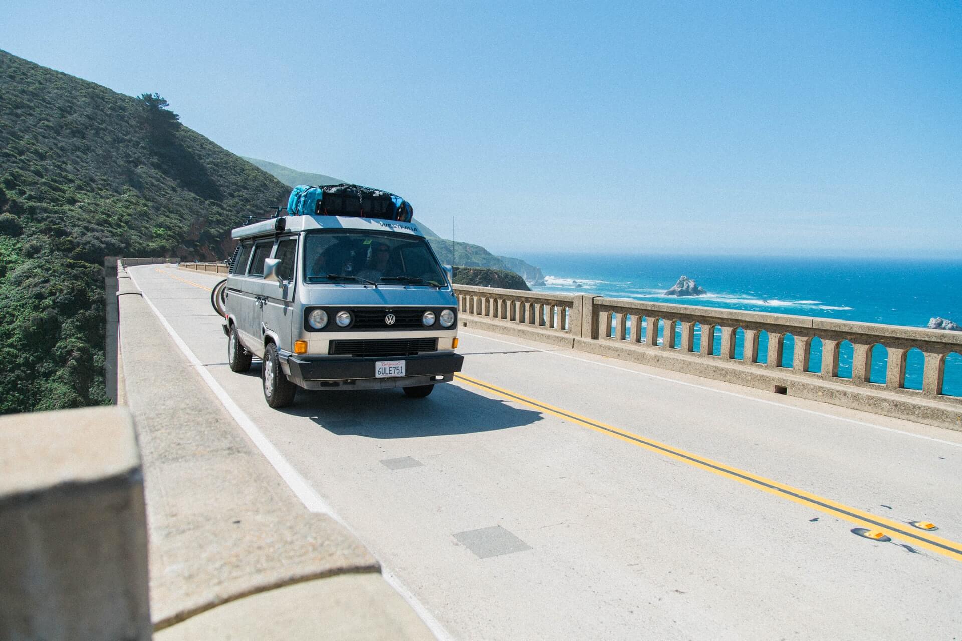 van on bridge on big sur while on west coast road trip