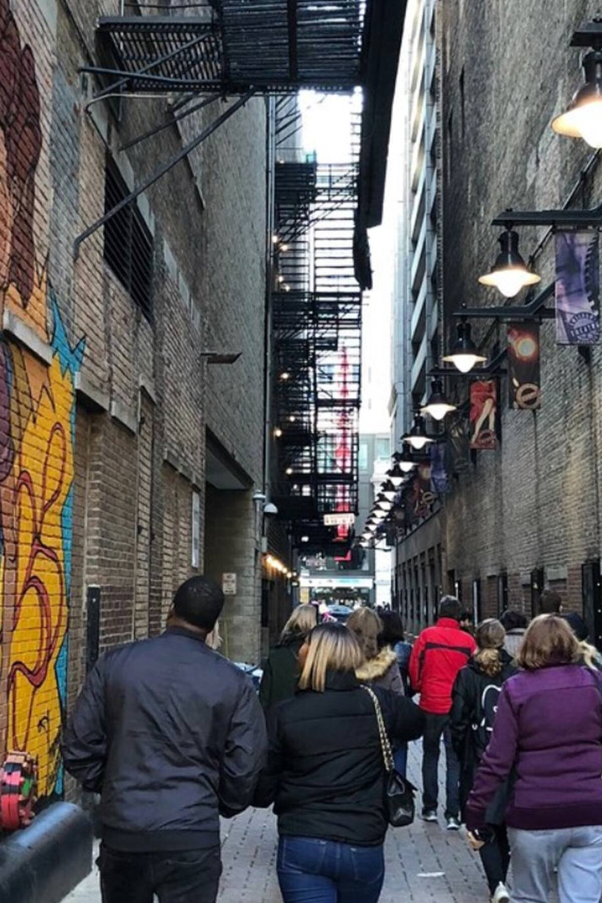 people walking on a street tour while visiting chicago best airbnb in chicago