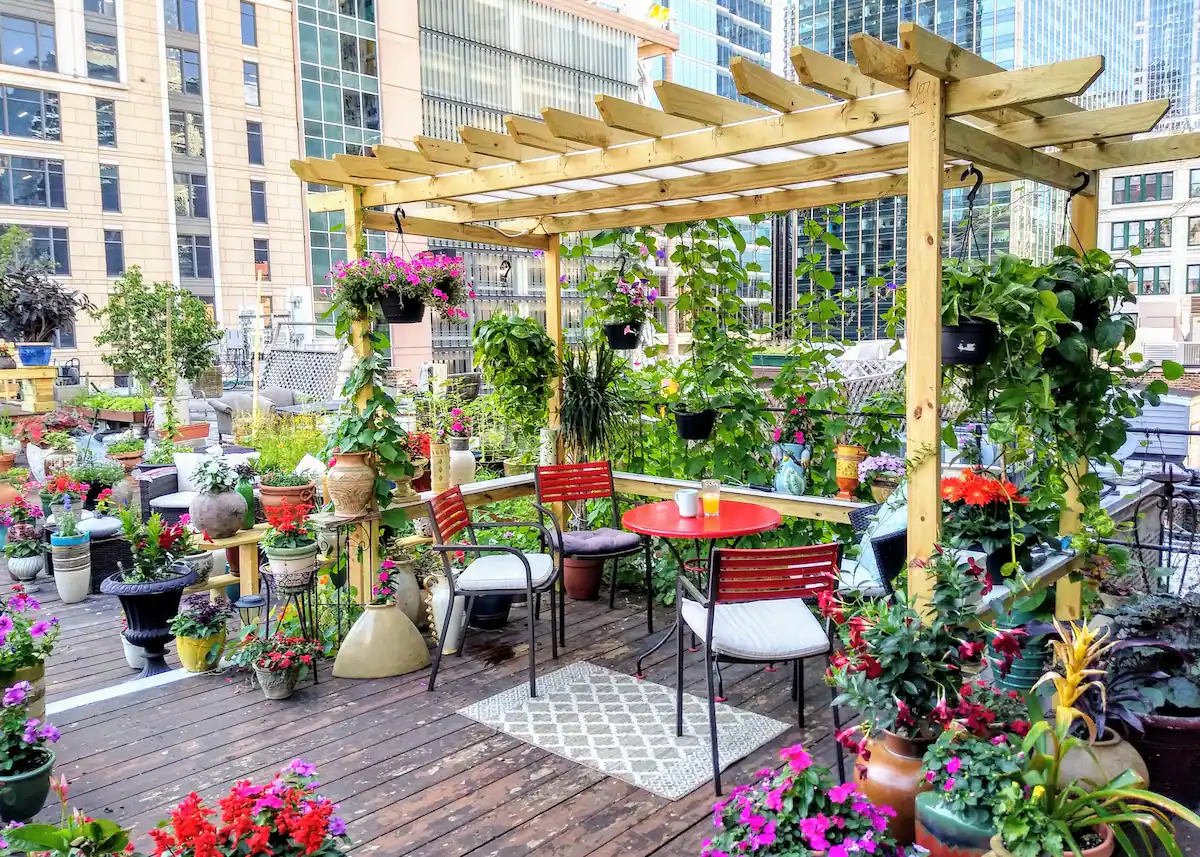 tons of flowers on an outdoor deck of a chicago airbnb