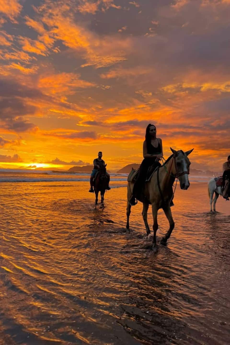 Go horseback riding during sunset in Jaco
