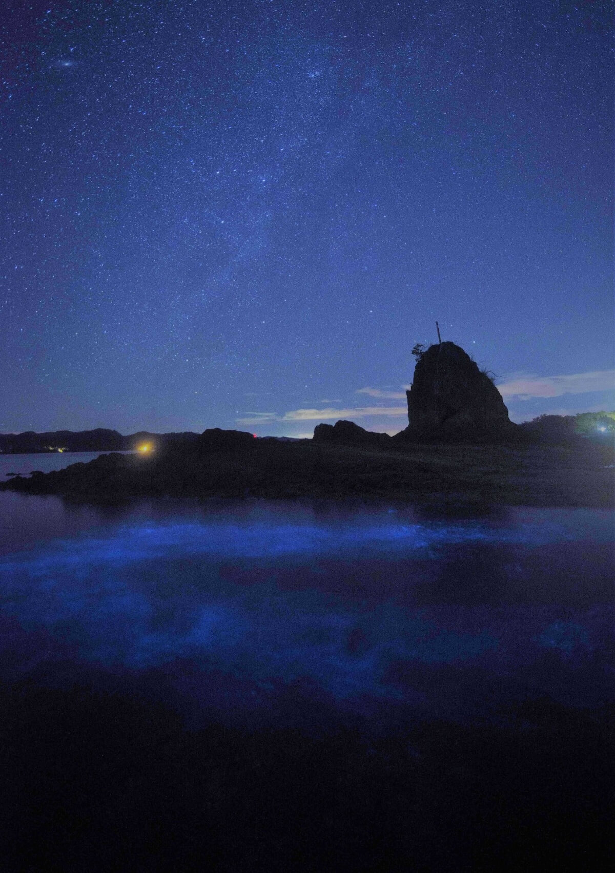 Kayak at nighttime in bioluminescent waters