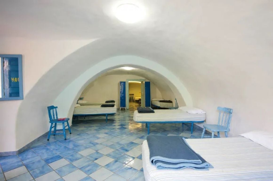 classic white wall architecture with blue furnishings in Ring Hostel Ischia