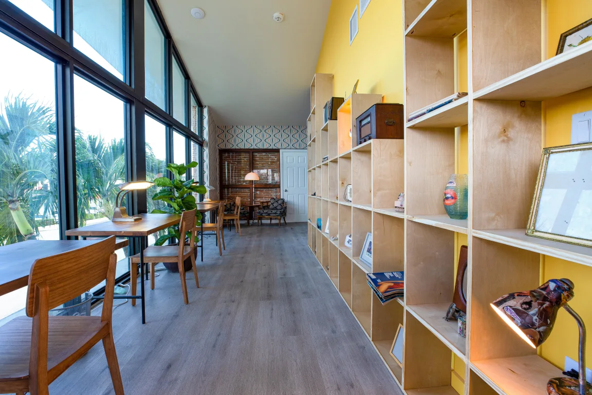 wooden desks in a coworking space at the best digital nomad hostel in miami