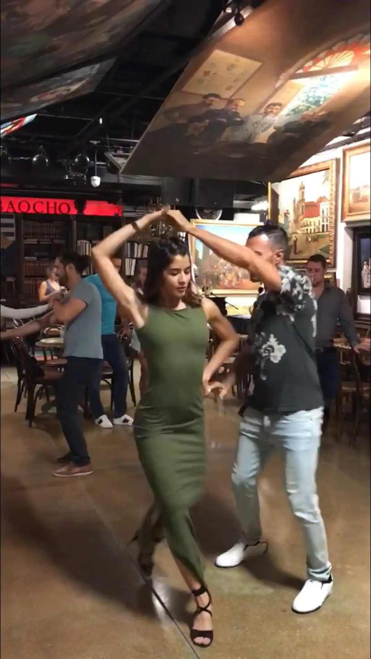 couple dancing salsa while staying in miami