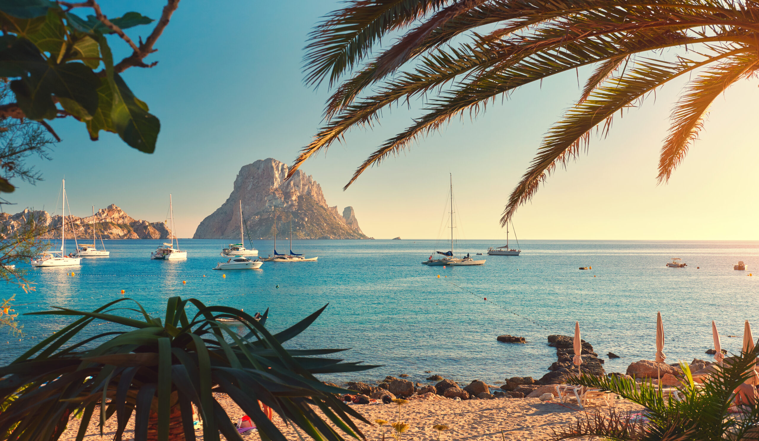 Beautiful Ibiza shore with iconic boats