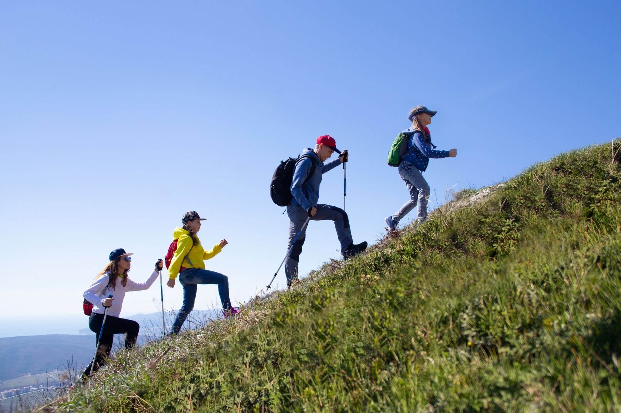 leading a group of people through a hike in the mountains