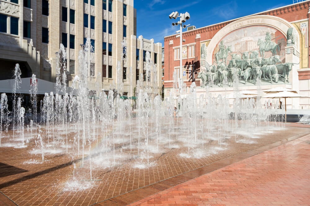 Shop till you Drop at Sundance Square, there's a water feature squirting to help you cool off too