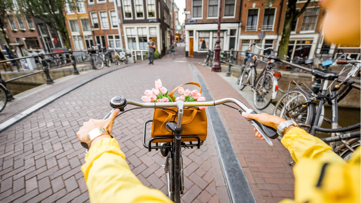 girl riding a bike in amsterdam