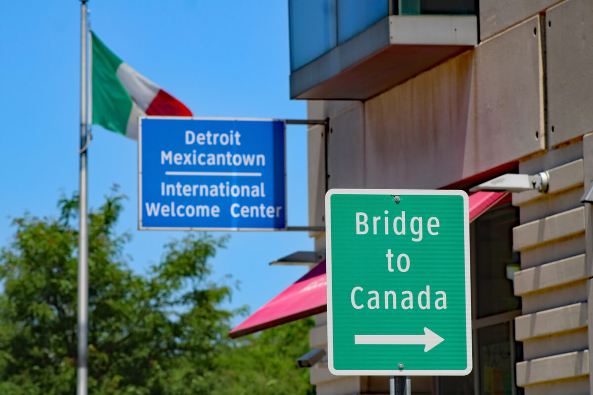 mexican town and bridge to canada sign traveling in detroit