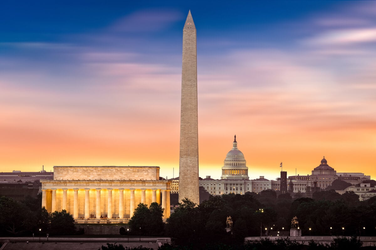 major washington dc attractions as seen beneath an orange and blue sunrise