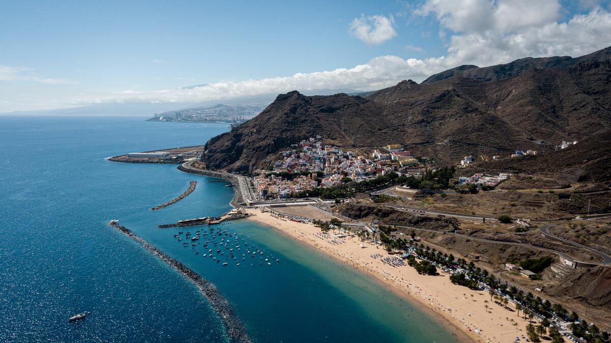 Atlantic Ocean coast in Tenerife with mountains and towns.