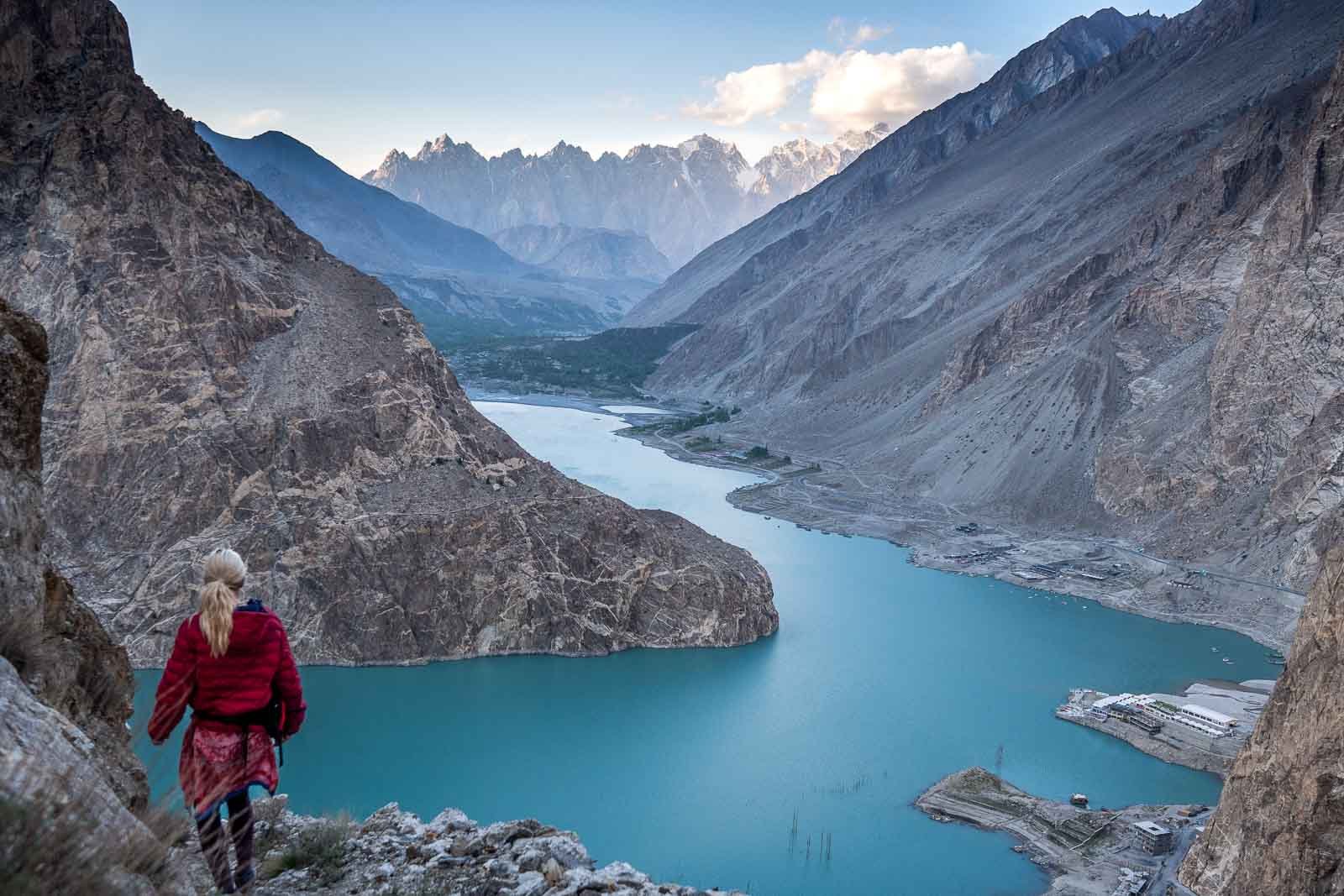 girl walking on mountain cliff in pakistan budget travel