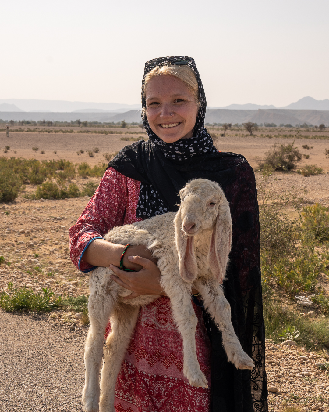 girl holding lamb