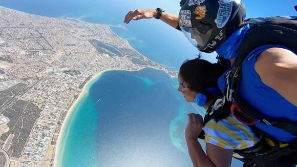 Tandem Skydivers look down on view of Perth and Blue Ocean