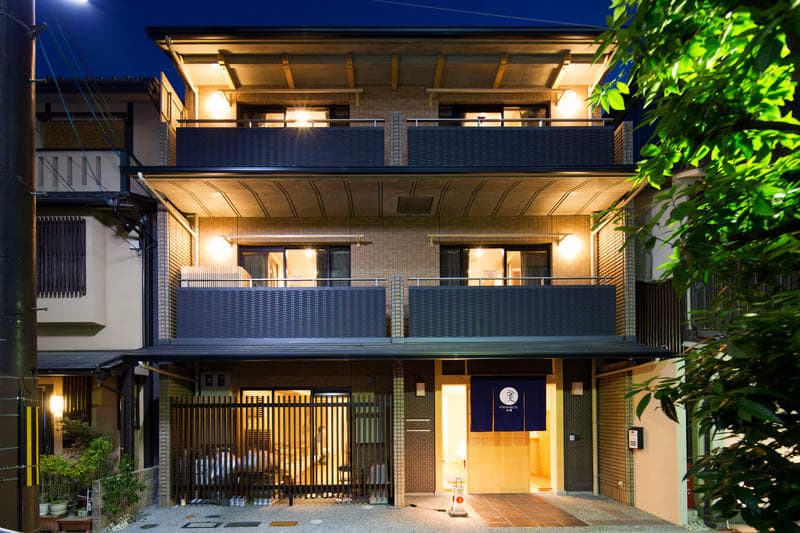 Ryokan Hostel Gion - Best Overall Hostel in Kyoto view from outside, looking at the building with balconies