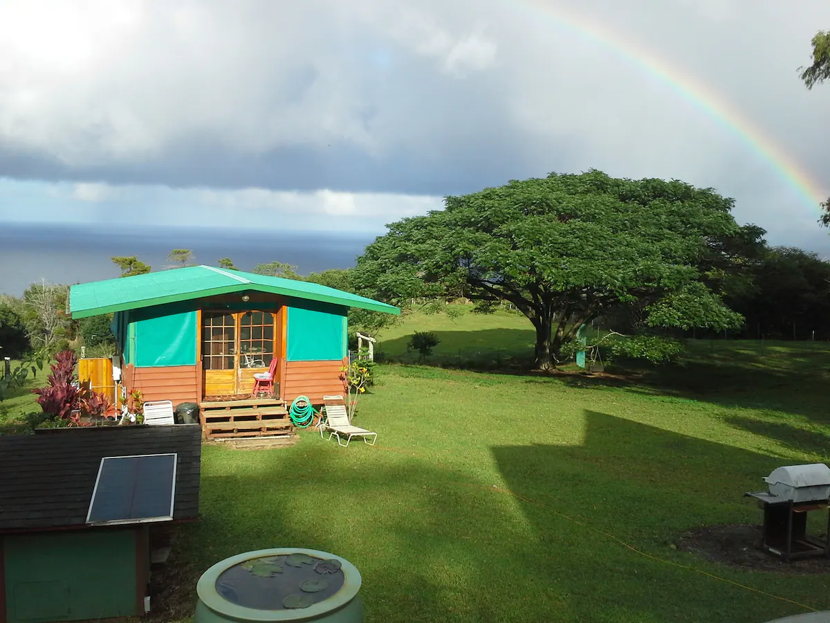 green cabin overlooking the ocean in hawaii