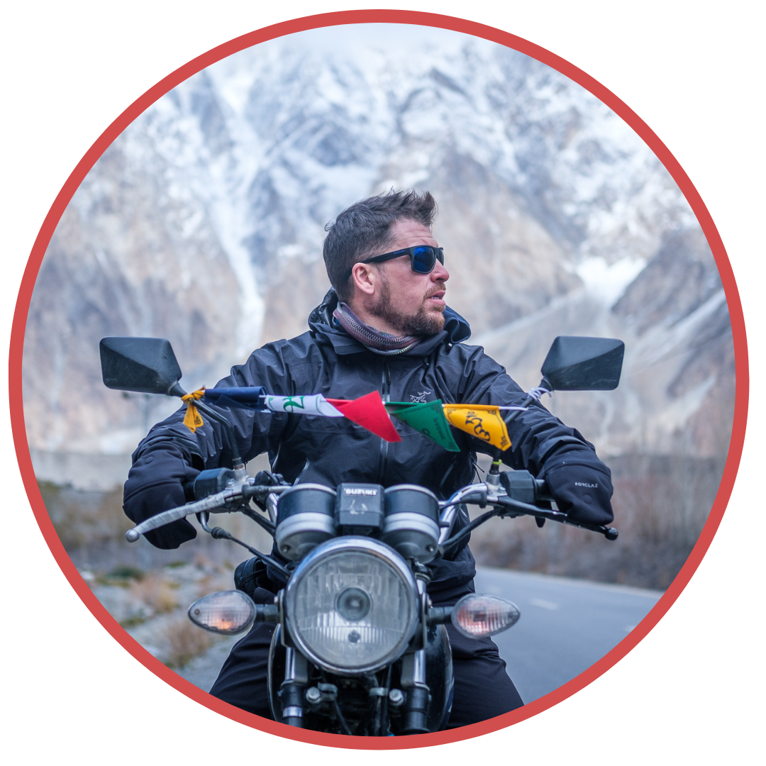 photo of Will Hatton on a motorbike, founder of The Broke Backpacker site