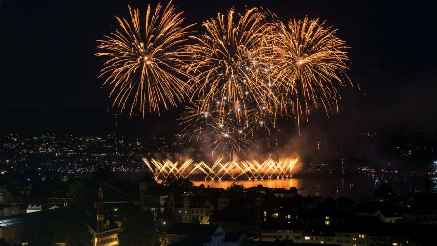 Bursts of fireworks illuminate the night sky during Zuri Fascht 
