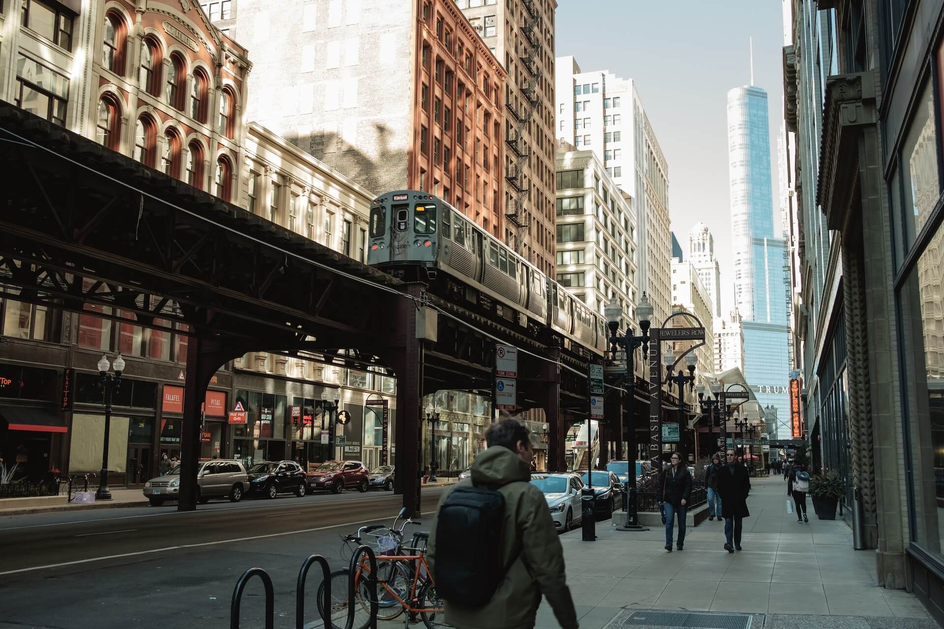 Pedestrians strolling along a walkway in the heart of Chicago city.