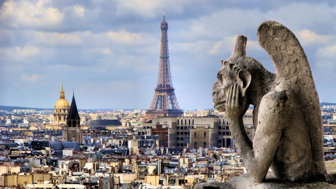 statue in paris overlooking the eiffel tower