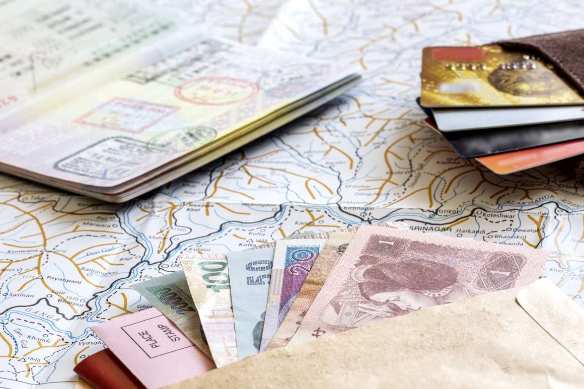 passport cash wallet with credit cards and map