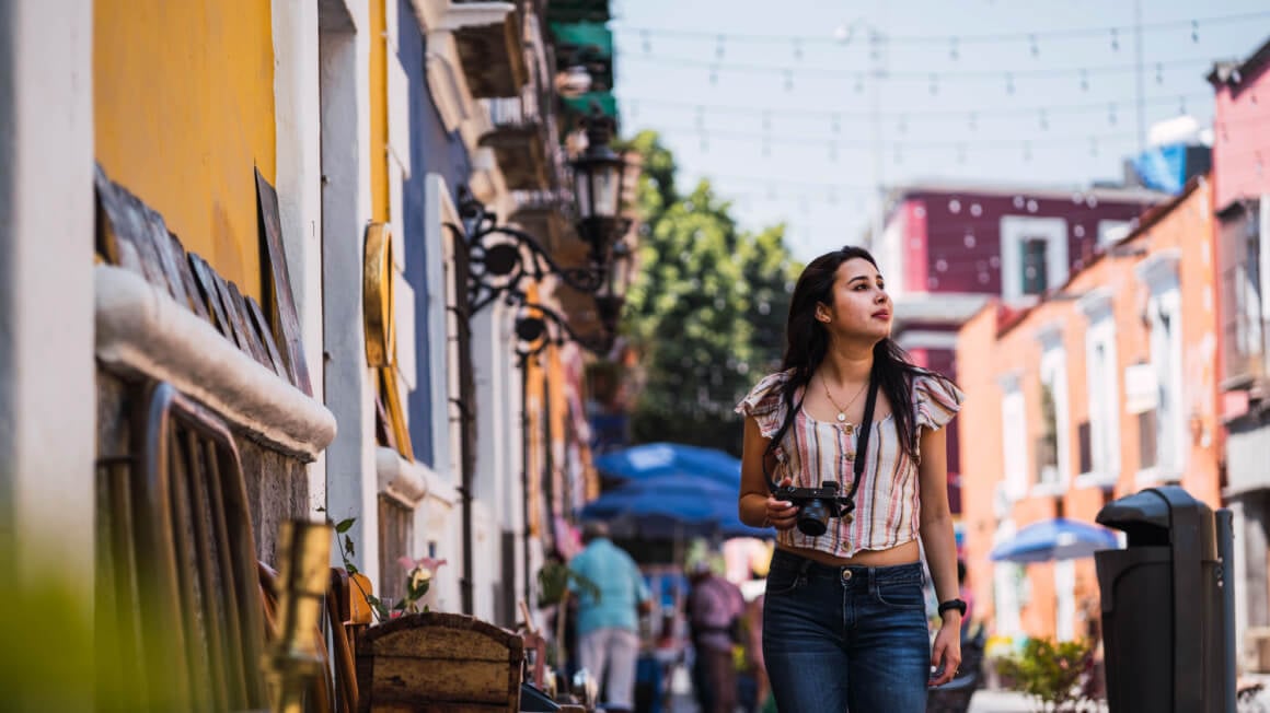 Solo female traveler roaming Mexico City's streets.