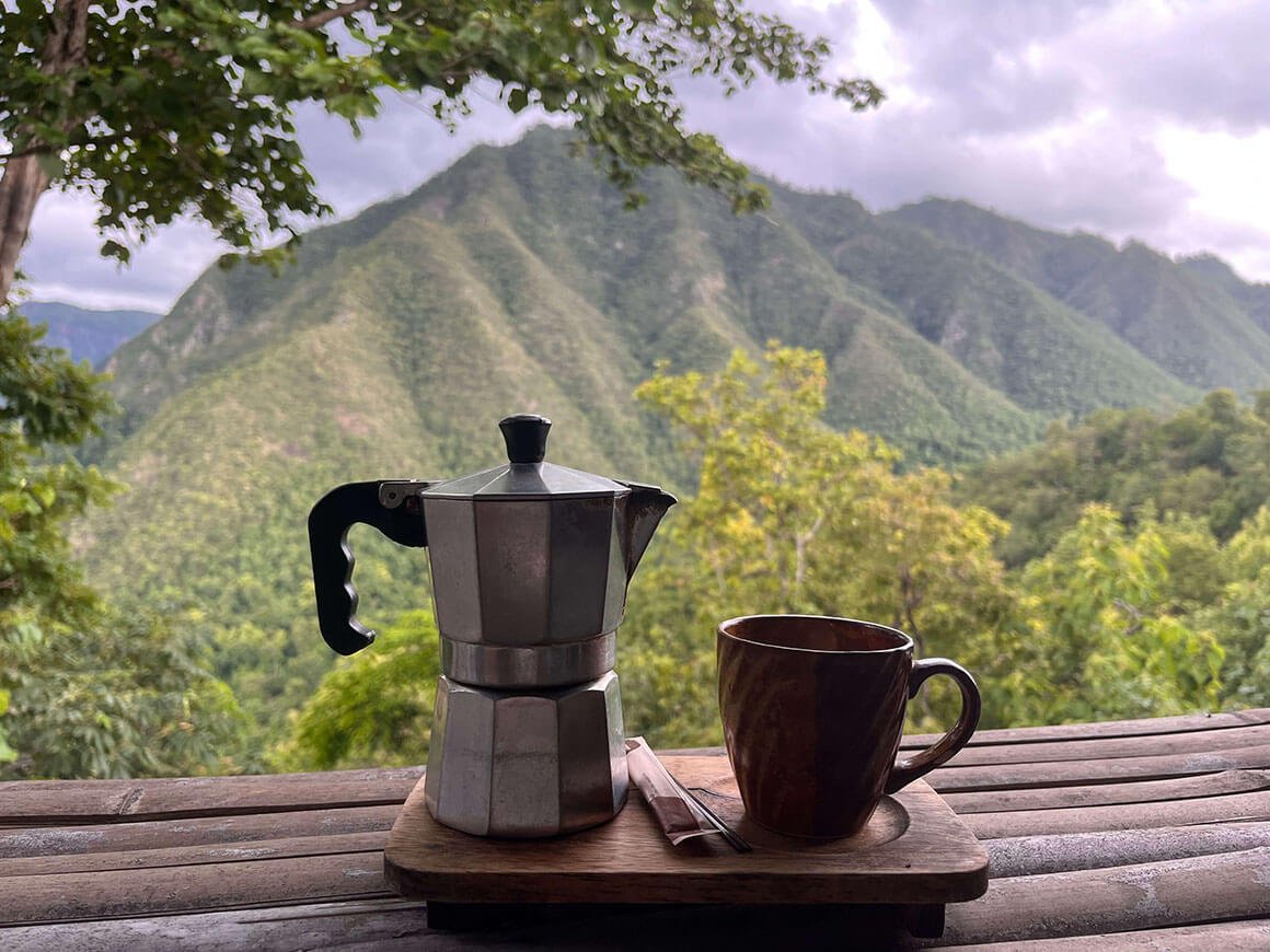 italian moka pot coffee with a backdrop of mountains in mae hong son, thailand