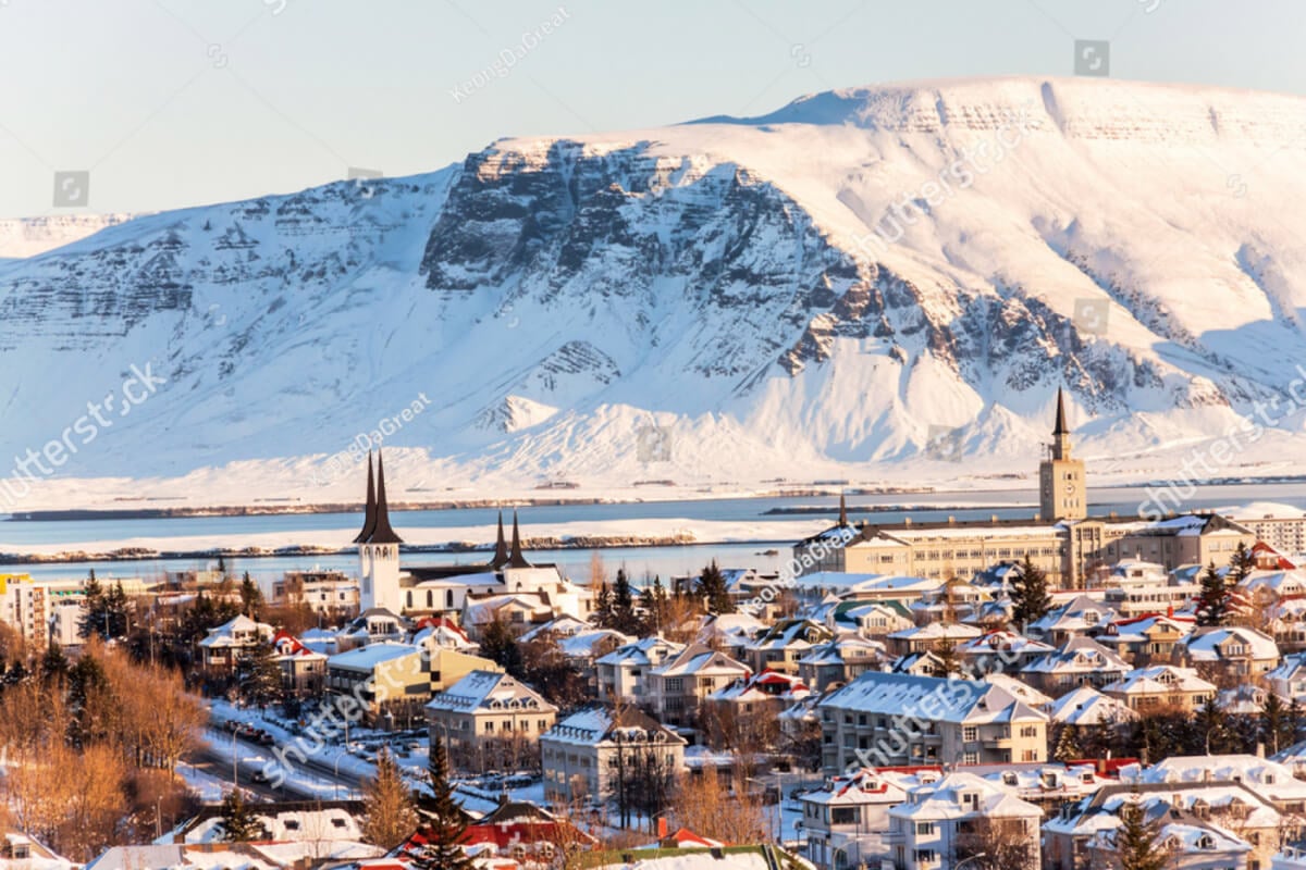 Reykjavik with snowy mountains rising behind